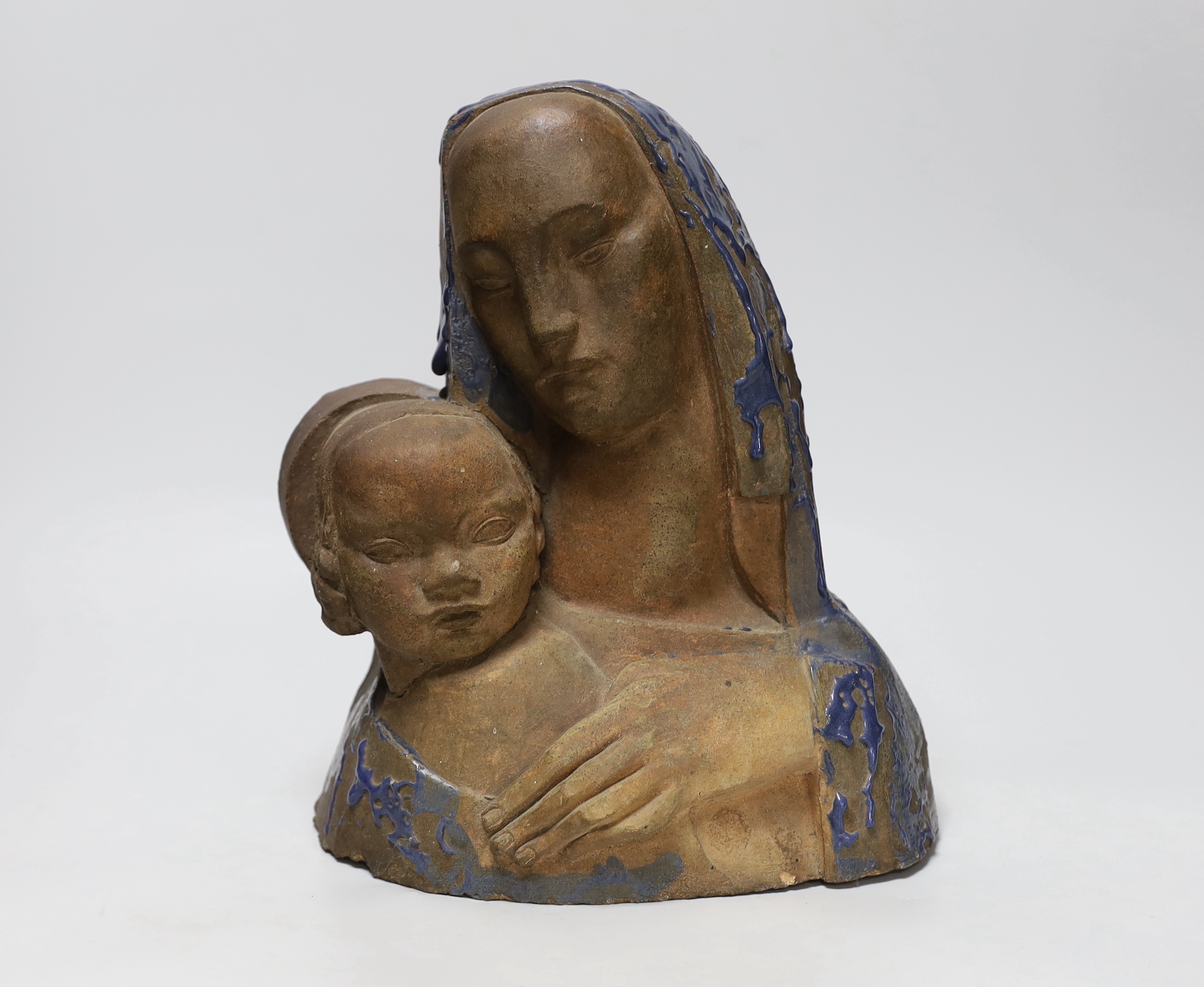 A terracotta Virgin and child bust with drizzle glazed headdress, height 28cm